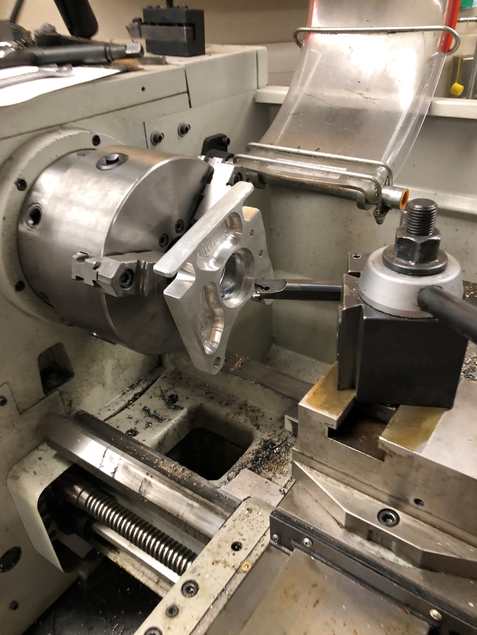 Machining a suspension component on a lathe in the Western student shop