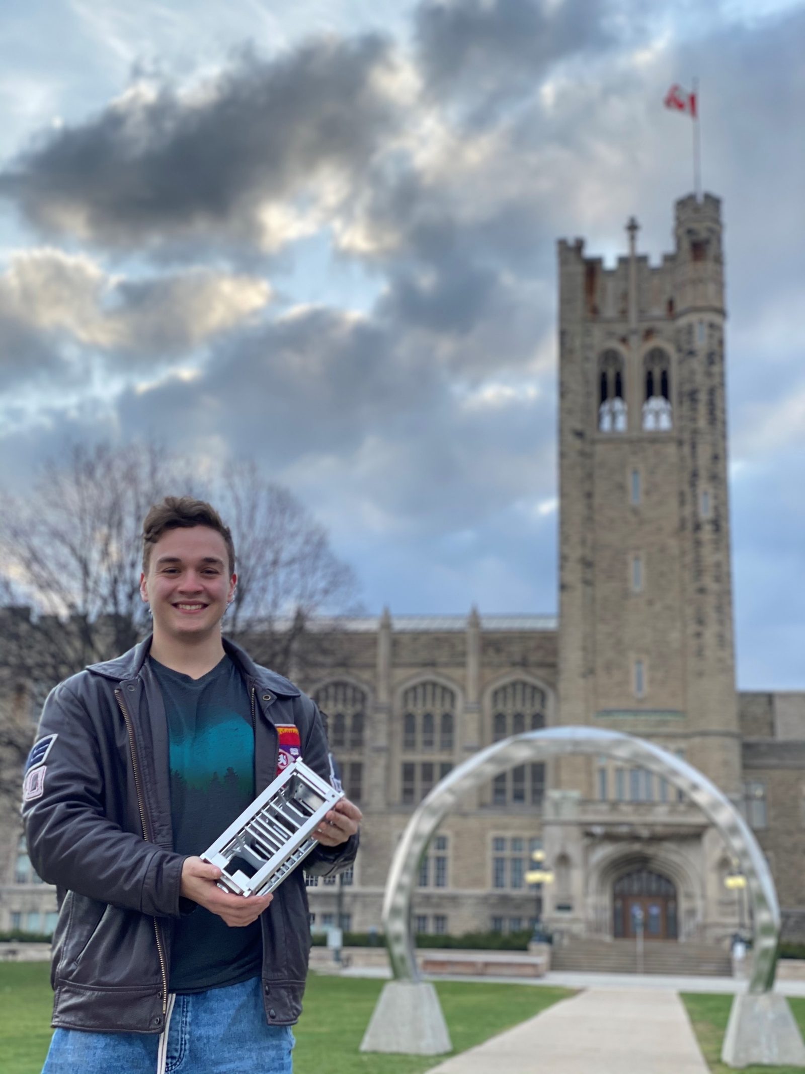 Matthew Margittay holding the UKPIK-1 CubeSat structure at Western University