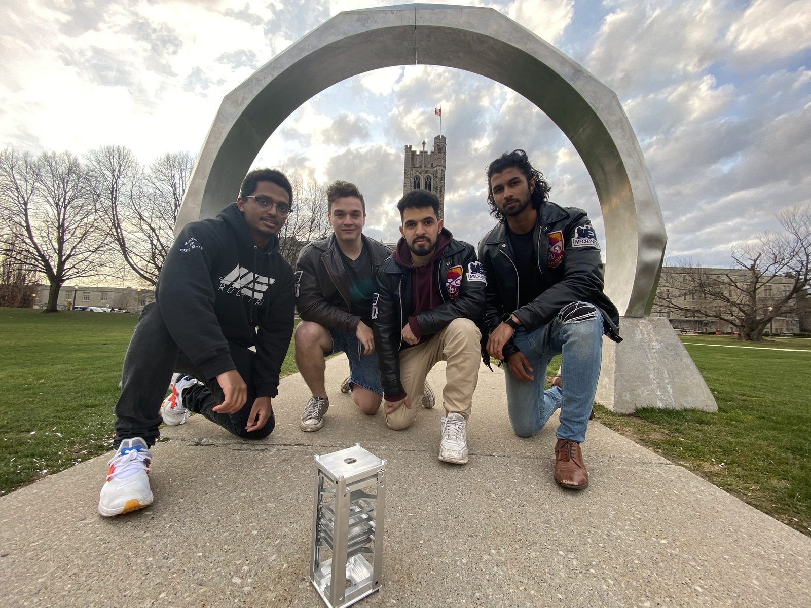 UKPIK-1 team with the CubeSat structure at the Western University arch